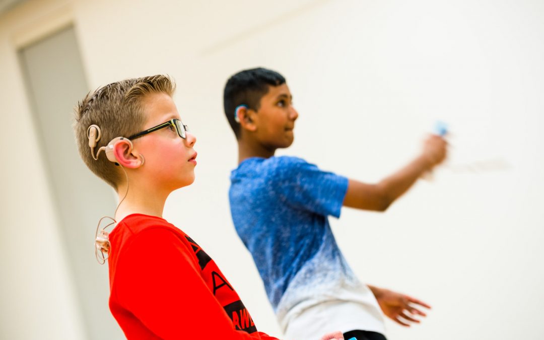 Two young deaf boys playing a game at their local Deaf Youth Club.